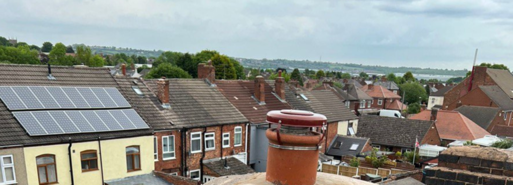 This is a photo taken from a roof which is being repaired by LJ Roofing Marlborough, it shows a street of houses, and their roofs